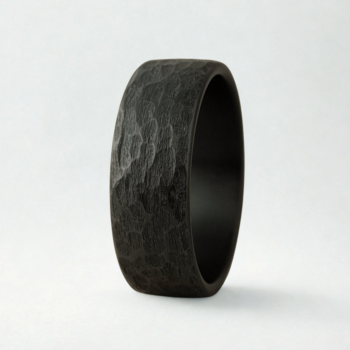 Black textured ring on a white background