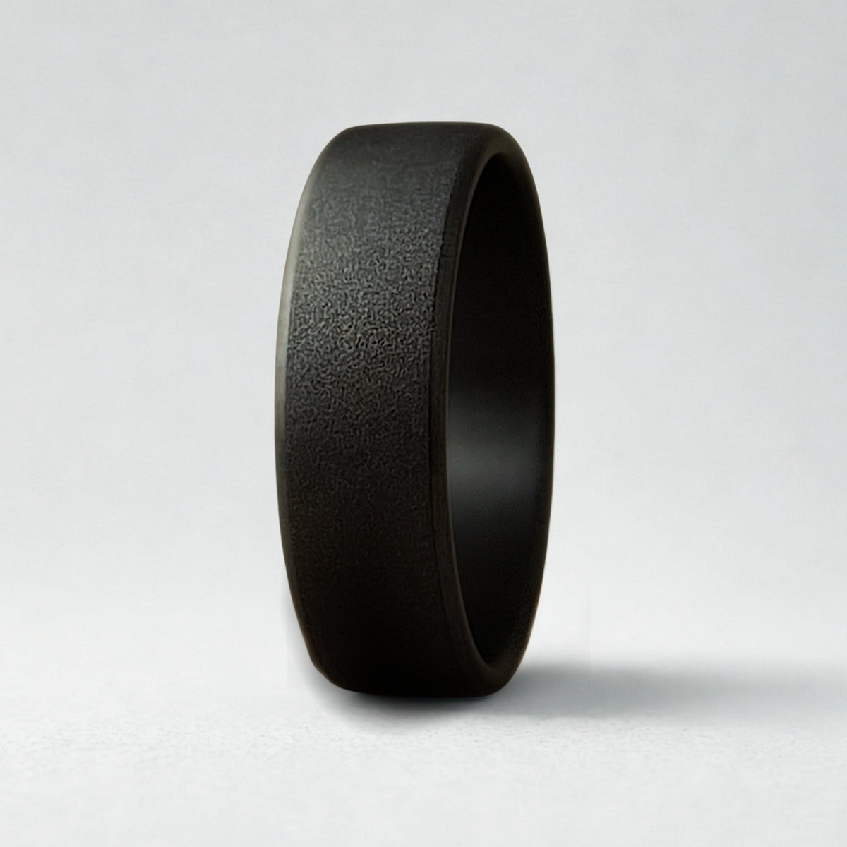 A textured black ring on a white background