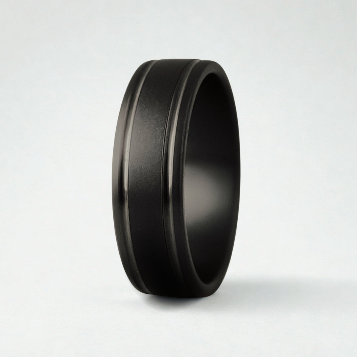 A black ring with two grooves on a white background