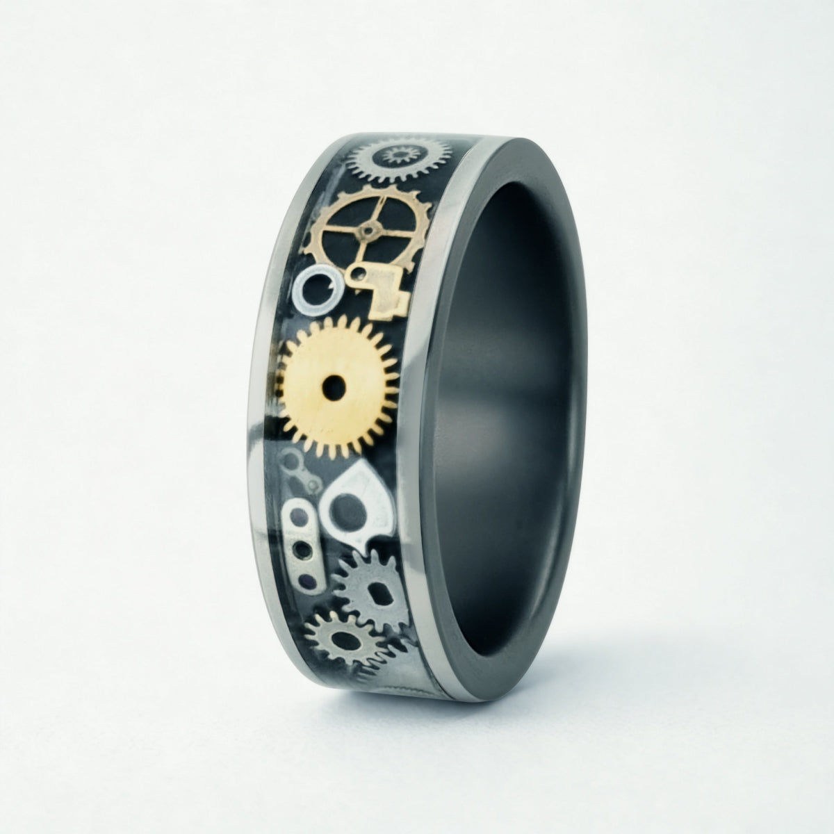 Ring with mechanical gear design on a light gray background