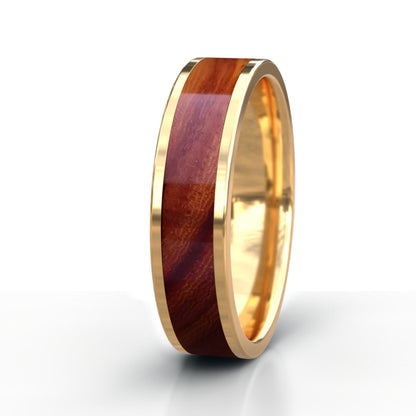 Gold ring with a wooden inlay on a white background
