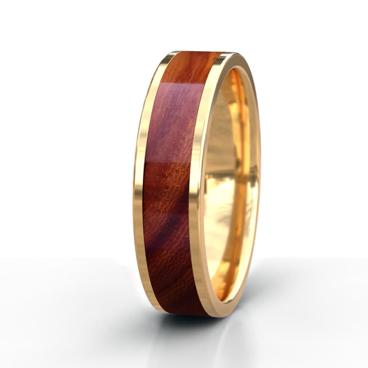 Gold ring with a wooden inlay on a white background