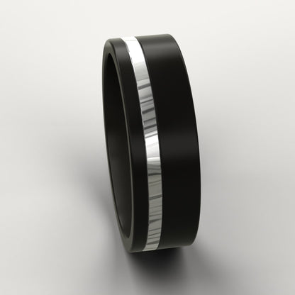 Black Zirconium Men's Ring with a Damascus line inlay on a light grey background