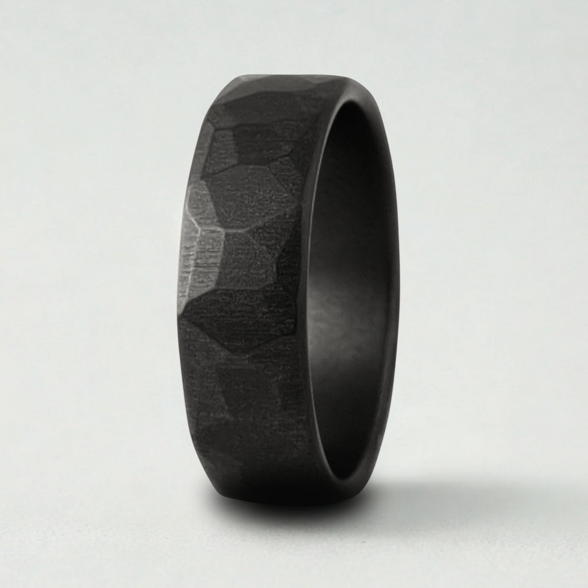 A black textured ring on a white background